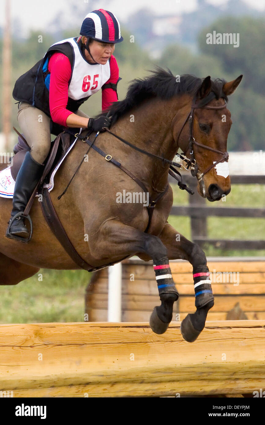 Intermediate level rider jumping over the Picnic Table on crosscountry