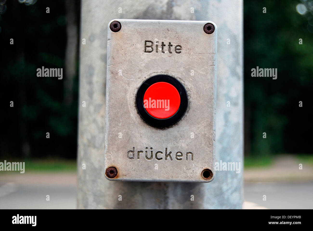 Red button, pedestrian traffic lights, Bitte druecken or please press Stock Photo