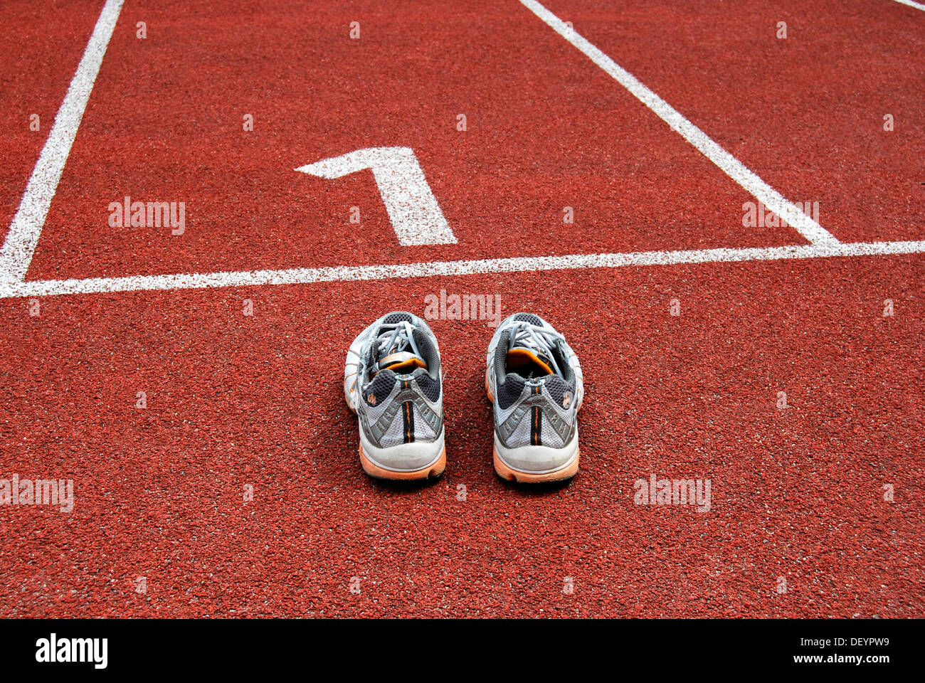 Running shoes a the starting line, lane 1 Stock Photo