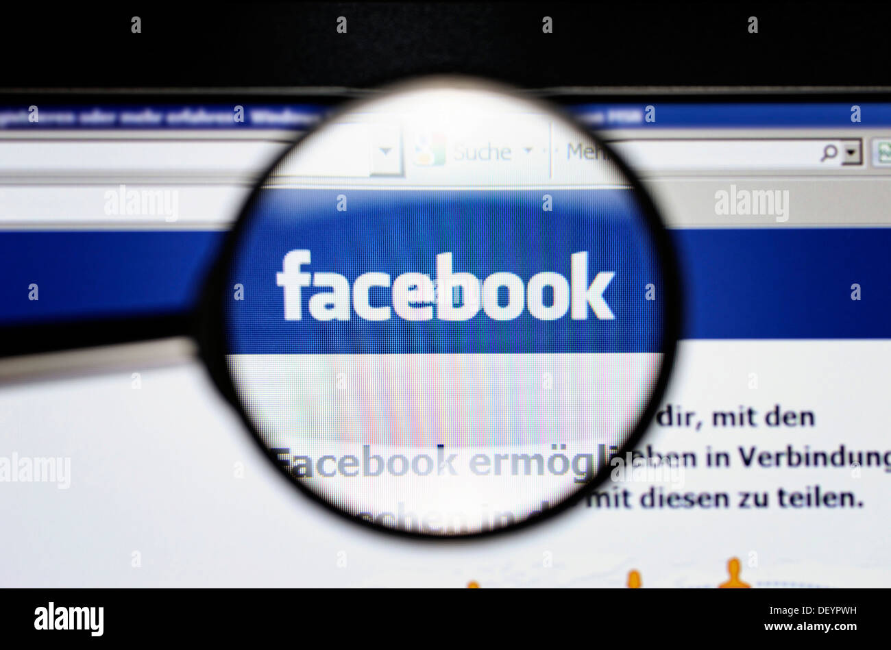 Social networking site Facebook under a magnifying glass, symbolic image Stock Photo