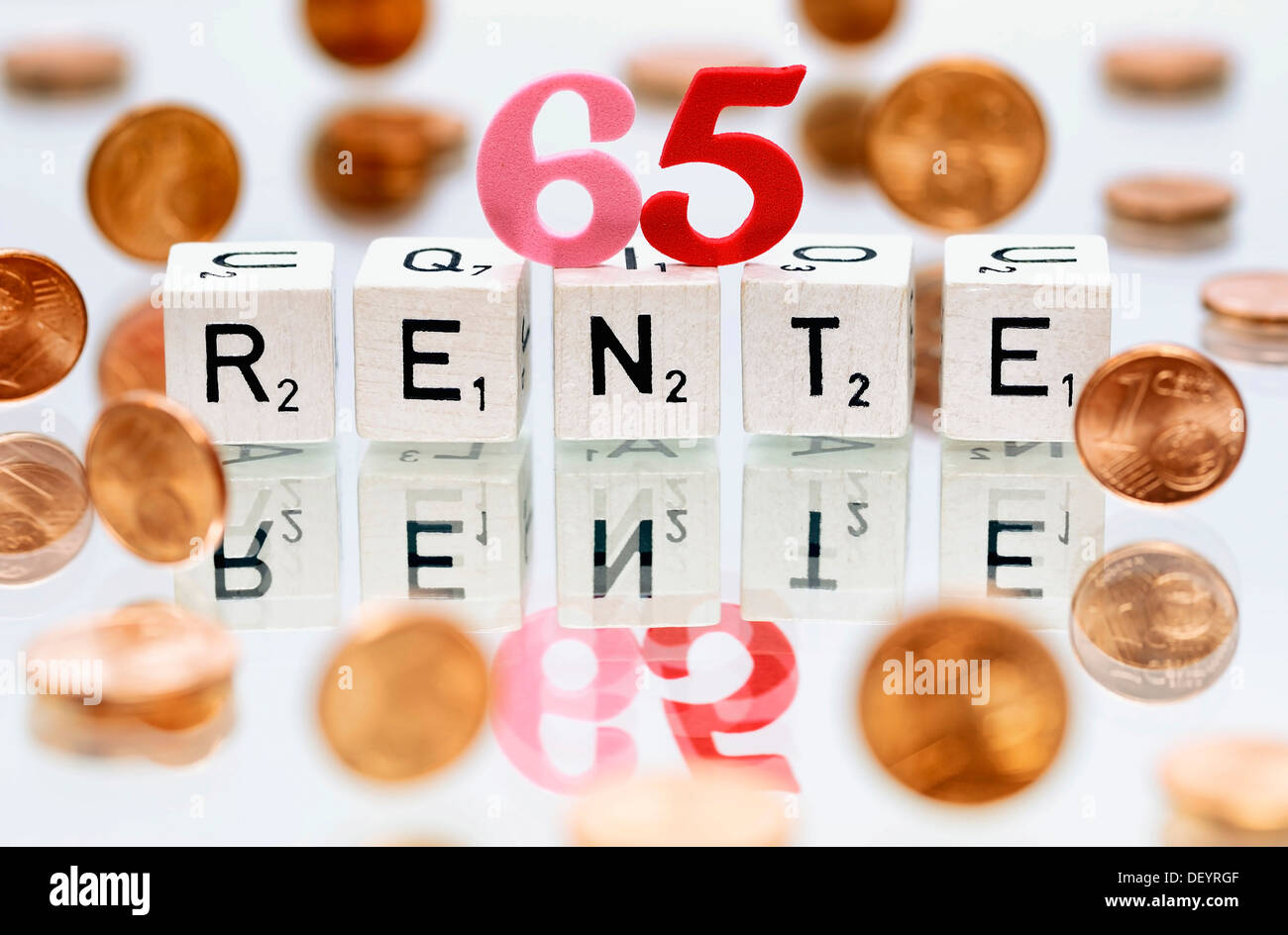 Cubes with letters forming the word 'Rente', German for 'pension', symbolic image for retirement starting at 65 years Stock Photo