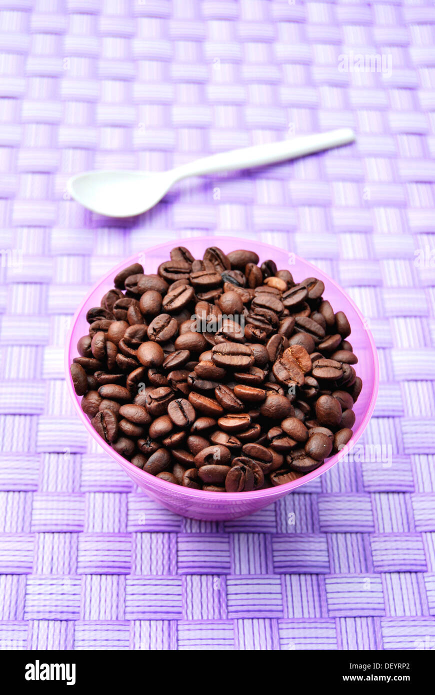 Bowl with coffee beans, spoon Stock Photo