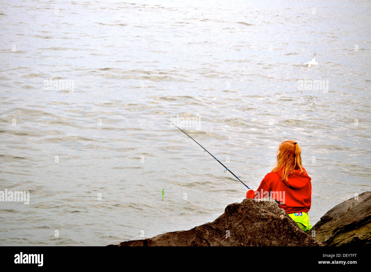 Woman fishes on Lake Erie Stock Photo