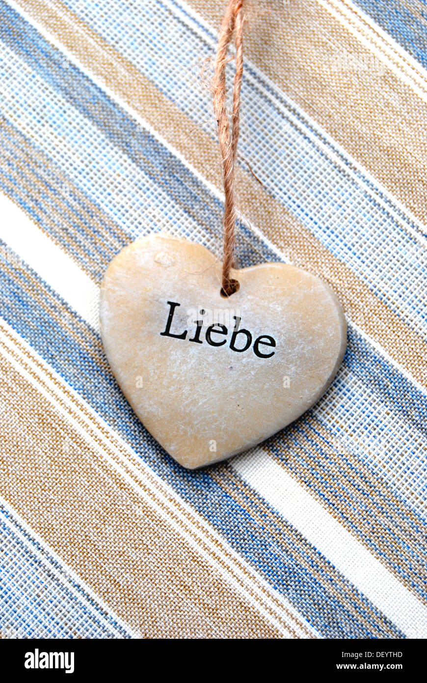 Lettering 'Liebe', German for 'love' on a heart of stone Stock Photo