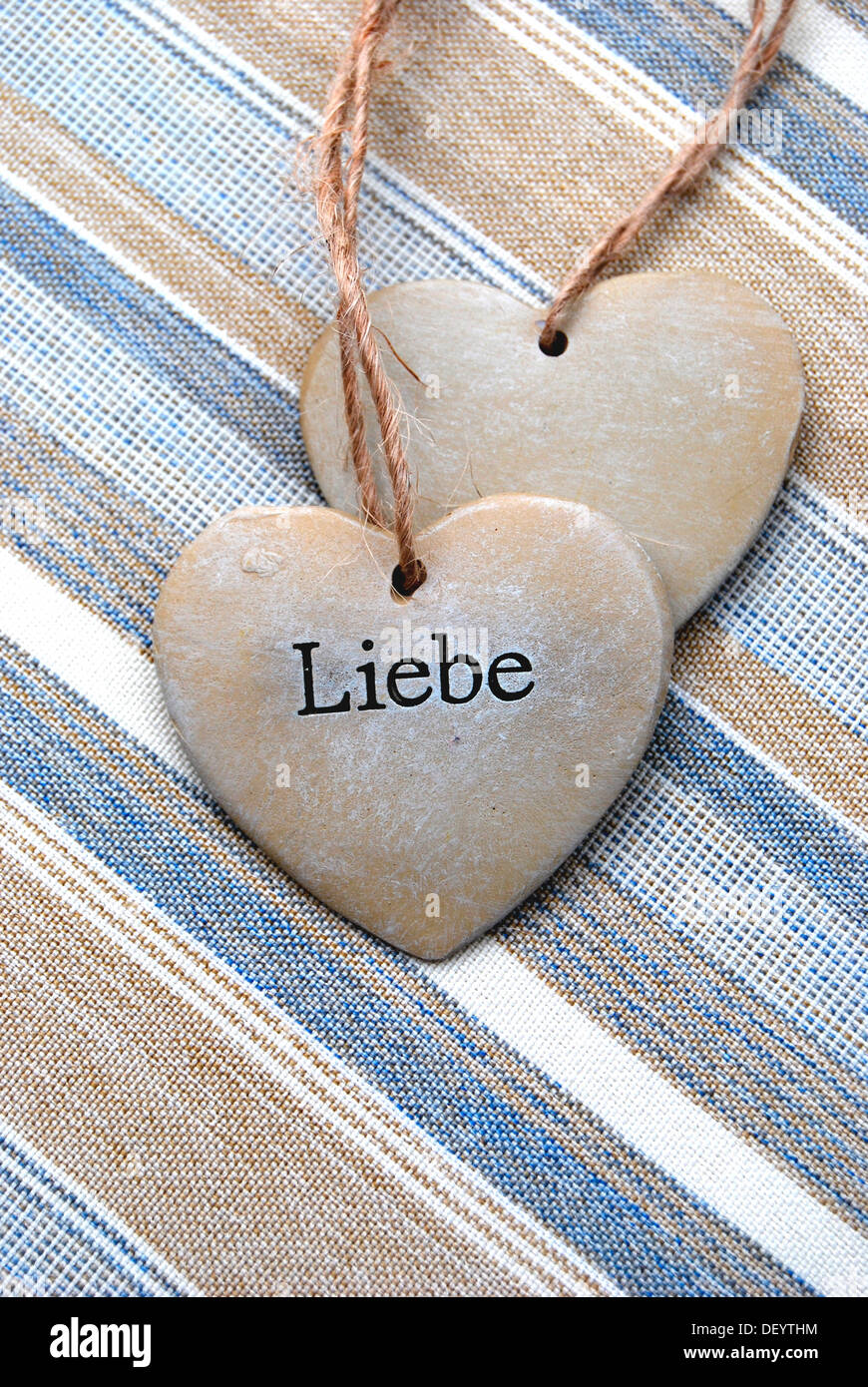 Two hearts of stone, lettering 'Liebe', German for 'love', symbolic image for solidarity Stock Photo