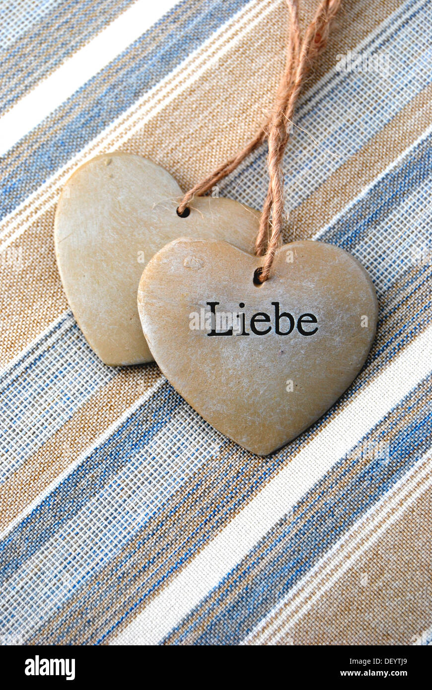 Two hearts of stone, lettering 'Liebe', German for 'love', symbolic image for solidarity Stock Photo