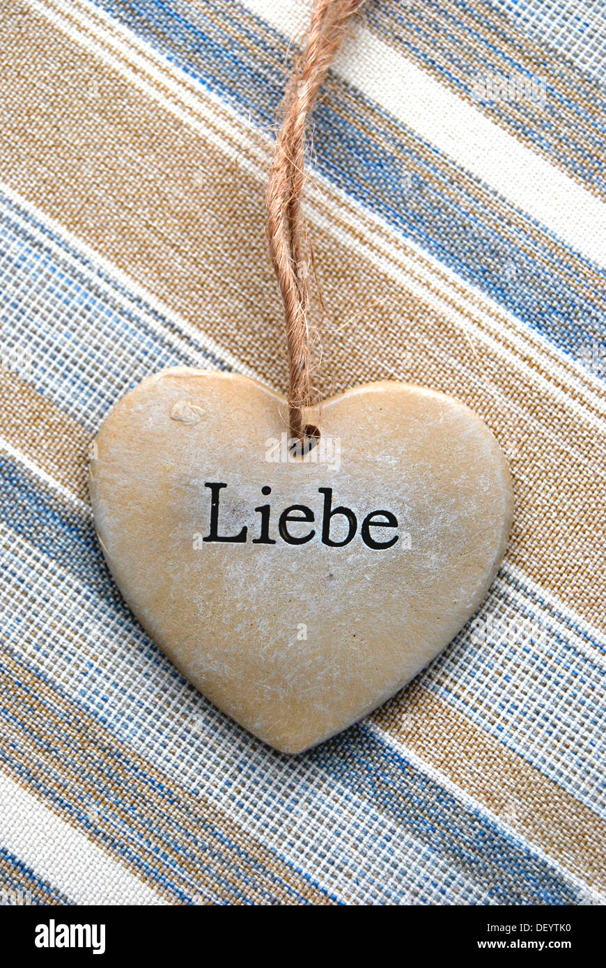 Lettering 'Liebe', German for 'love' on a heart of stone Stock Photo