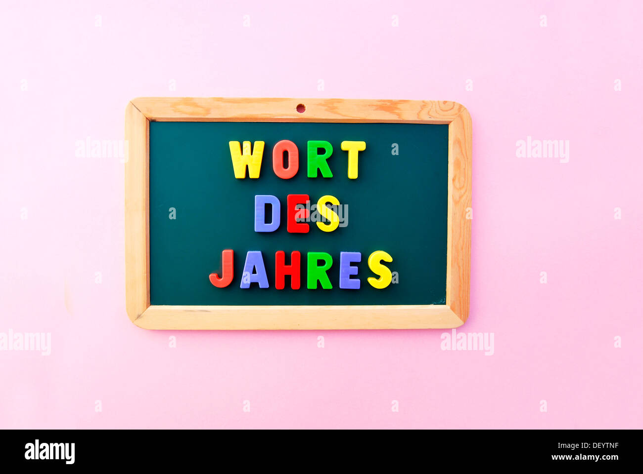 Wort des Jahres, German for Word of the Year, written in colourful magnetic letters on a school board Stock Photo