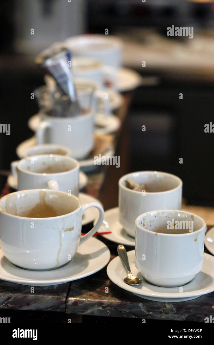 Dirty coffee cups on counter Stock Photo Alamy