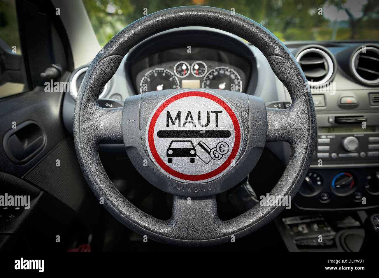 Passenger car toll, sign on steering wheel, PKW-Maut, Schild auf Steuerrad Stock Photo