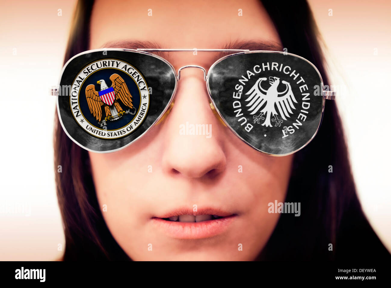 FEDERAL INTELLIGENCE SERVICE and NSA sign in the sunglasses of a woman, cooperation of Federal Intelligence Service and NSA, BND Stock Photo