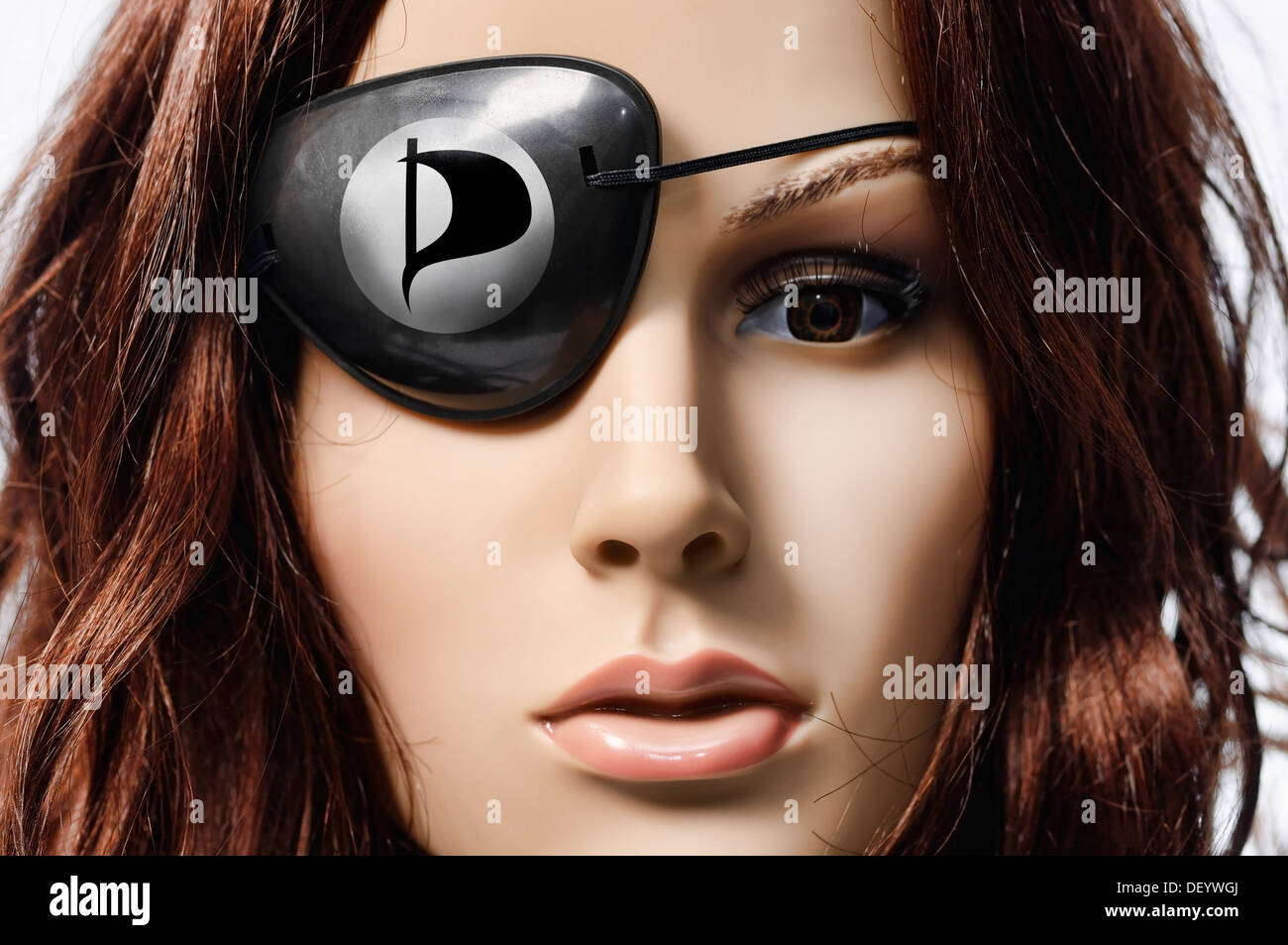 Shop-window mannequin wearing an eye patch with the logo of the Pirate Party of Germany Stock Photo