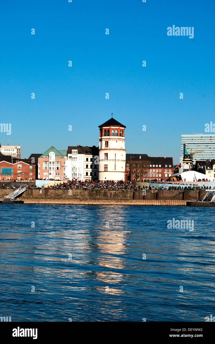 View across the Rhine River to Schlossturm tower, headquarters of the Schifffahrtsmuseum or Maritime Museum on the bank of the Stock Photo