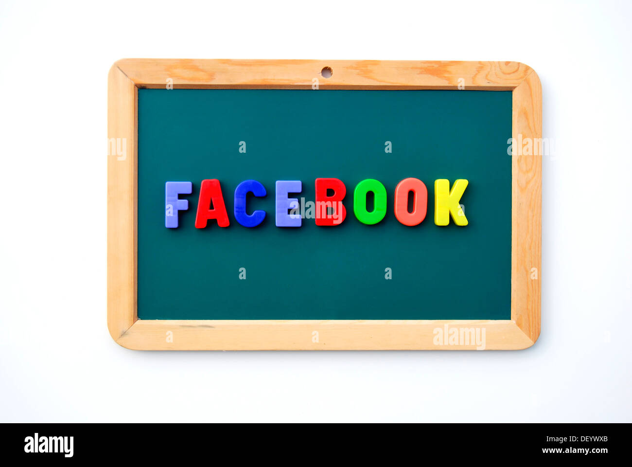 Facebook, written with colourful magnetic letters on a child's blackboard, online community, social networks, Internet platform Stock Photo