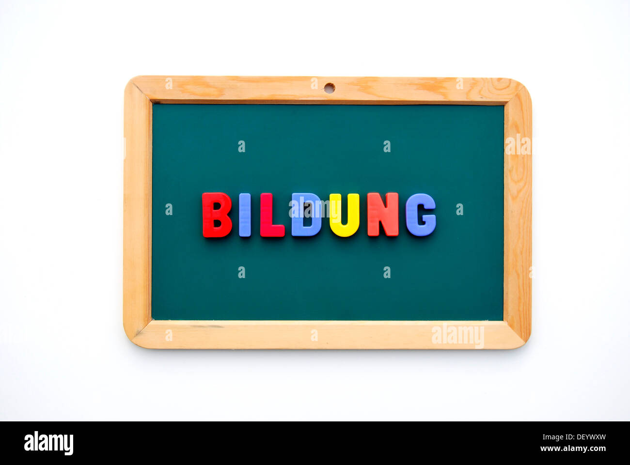 Bildung, German term for education, written with colourful magnetic letters on a child's blackboard Stock Photo