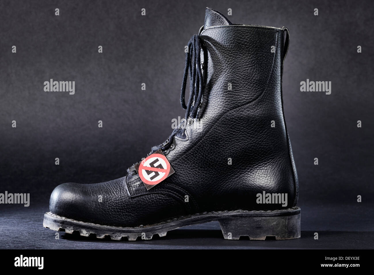 Combat boot with a badge with a crossed-out swastika, Germany Stock Photo