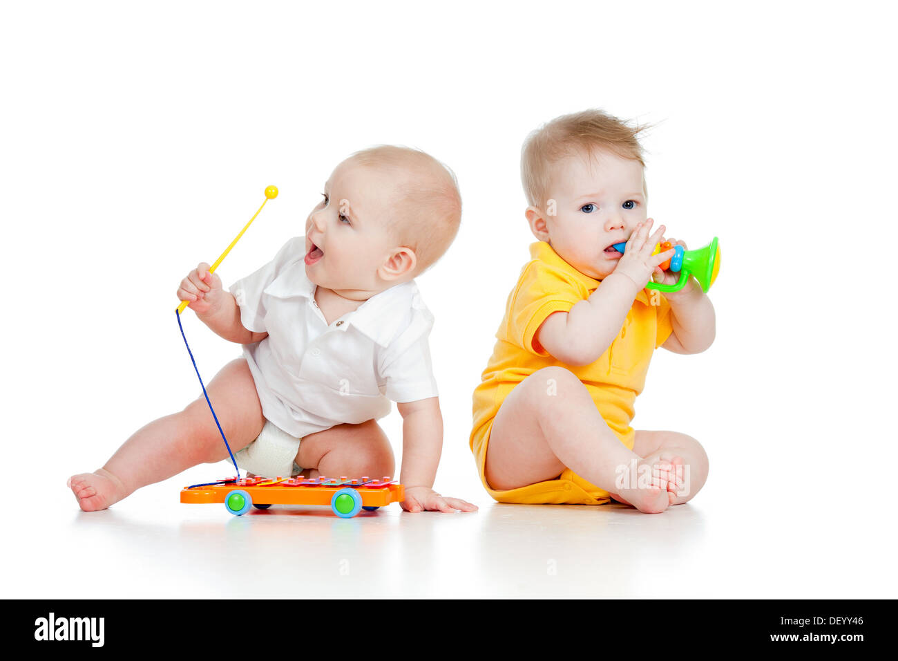 funny boy baby with musical toys Stock Photo - Alamy