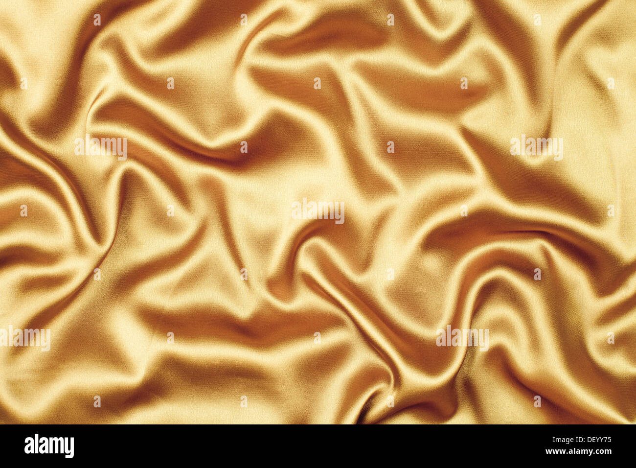 gold satin or silk fabric background Stock Photo
