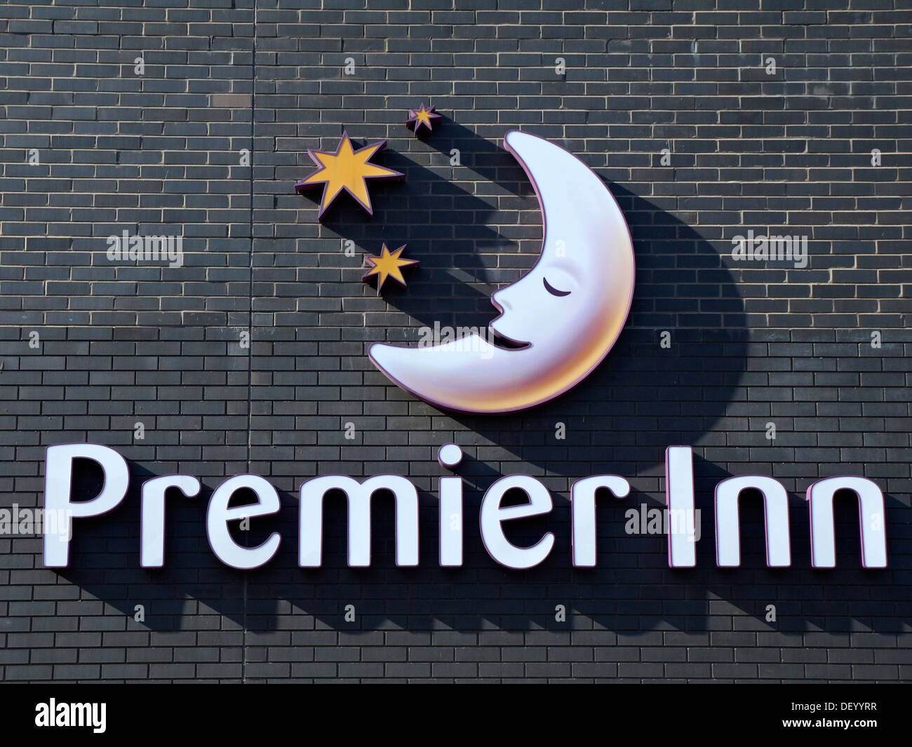 Premier Inn hotel sign on outside wall UK Stock Photo