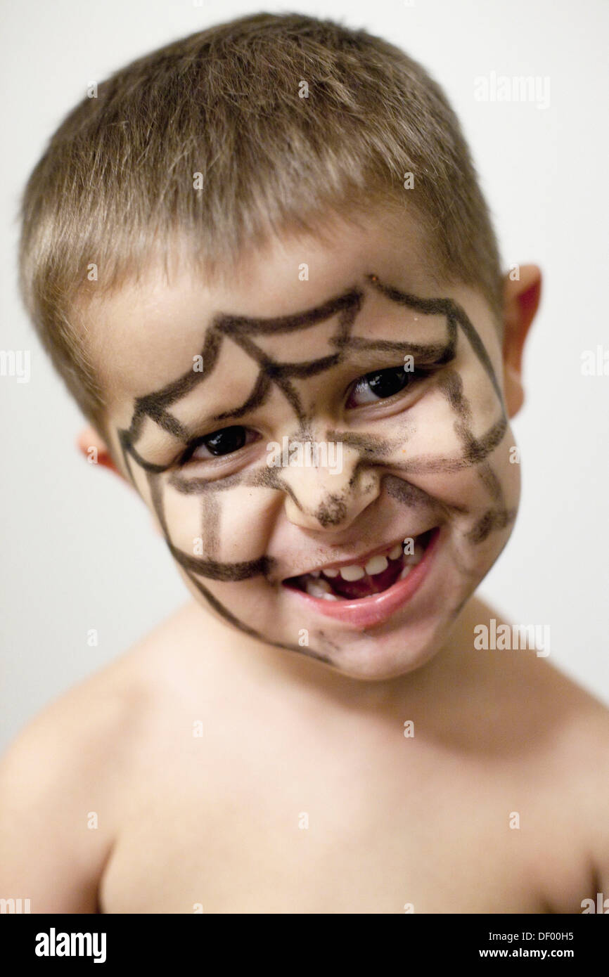 Child with painted face spiderman Stock Photo - Alamy