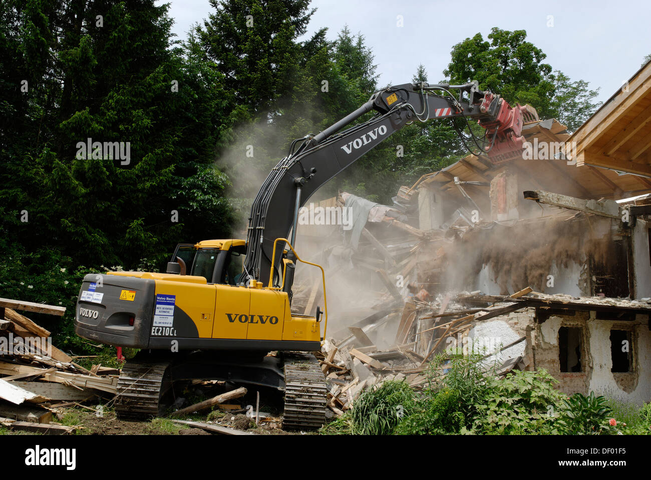 Demolition works with a digger, dismantling of a building, demolition