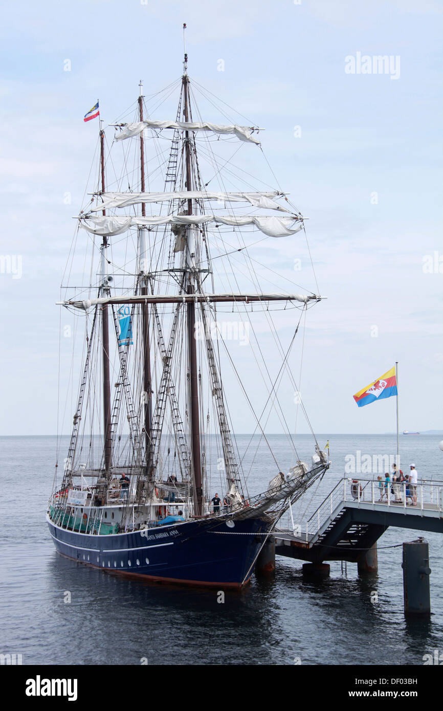 The three-masted traditional rig sailing ship Santa Barbara Anna moored at the pier in the seaside resort of Heringsdorf Stock Photo