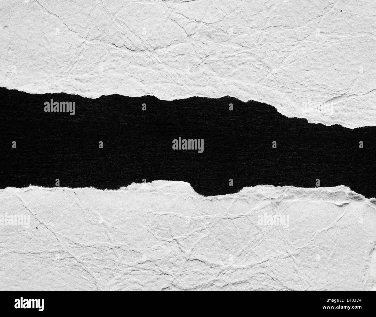 Hole ripped in paper. Advertising space Stock Photo - Alamy