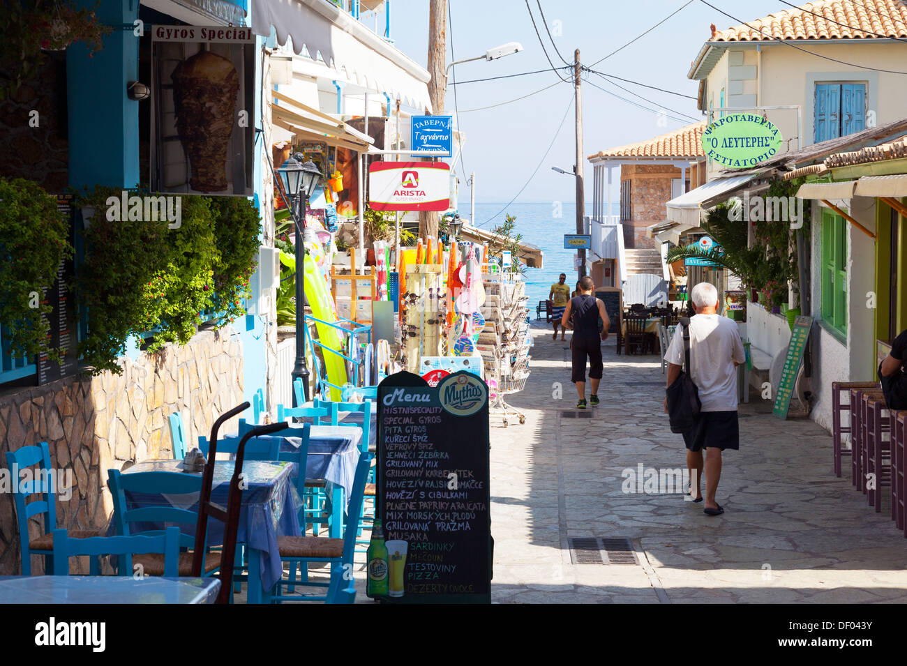Main street to beach tavernas restaurants line road Ag Agios Aghios Nikitas  Lefkada Lefkas Greek Island Greece Stock Photo - Alamy