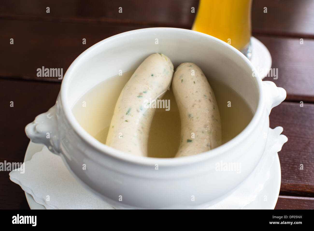 Weisswurst - typical Bavarian white sausages with Hefeweizen (wheat beer) Stock Photo