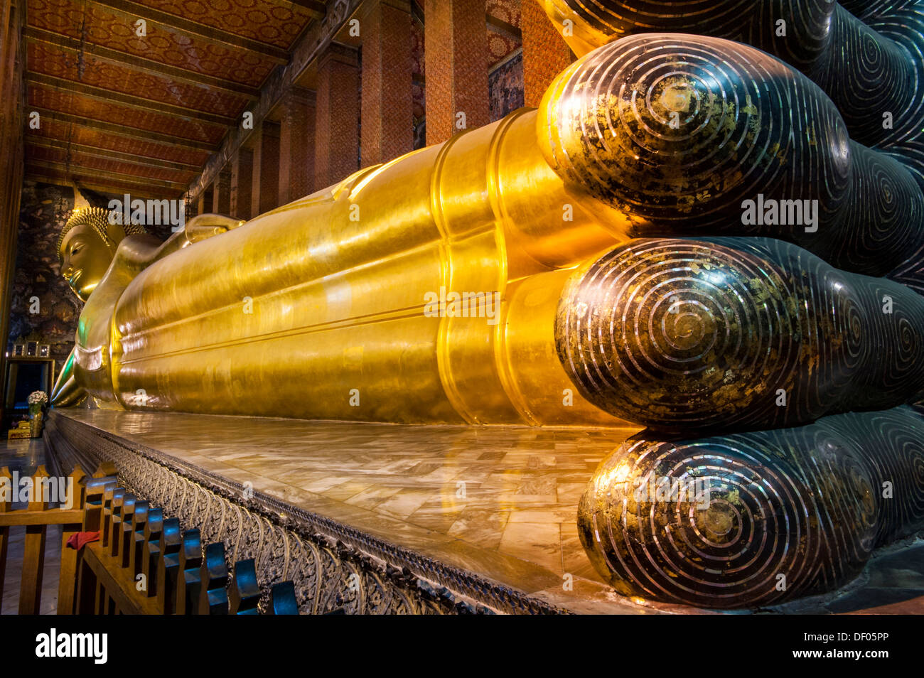 Reclining Buddha statue, mother of pearl inlays on the soles of the