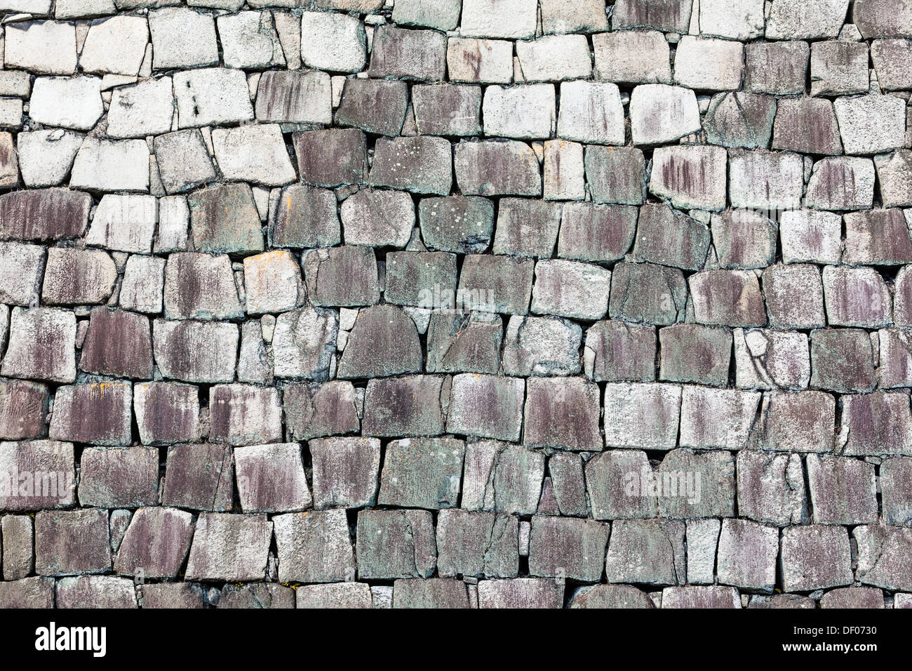 Stone wall of a traditional Japanese castle. Stock Photo