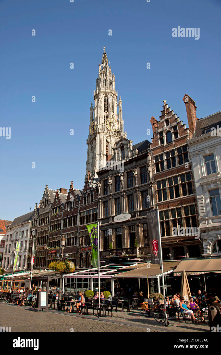 Guildhouses at the market square Grote Markt and the church tower of The Onze-Lieve-Vrouwekathedraal (Cathedral of our Lady) in Stock Photo