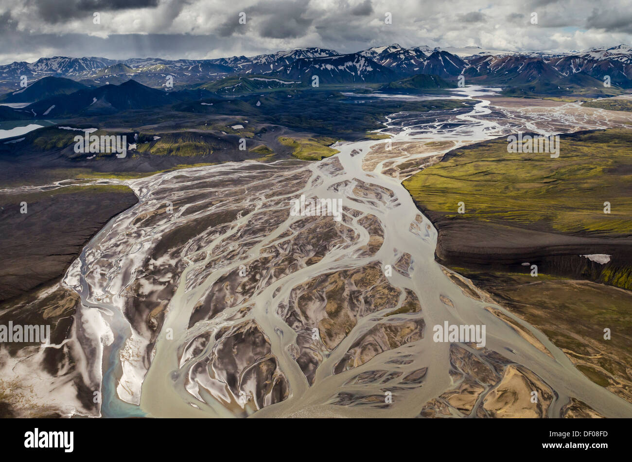 Aerial view, Tungnaá braided river, rhyolite mountains partially covered with snow, Landmannalaugar Stock Photo