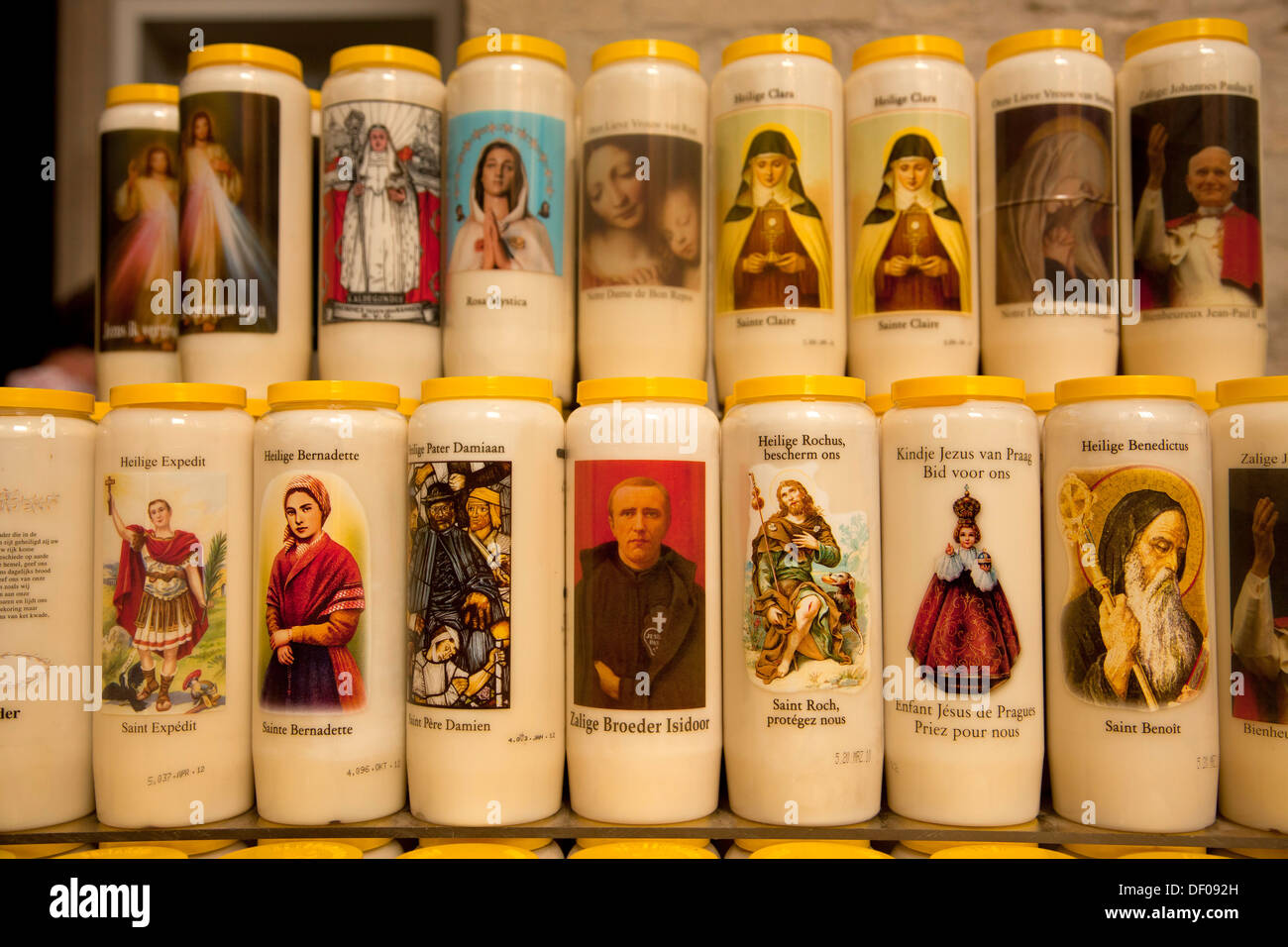 candles with saints images inside The Onze-Lieve-Vrouwekathedraal (Cathedral of our Lady) in Antwerp, Belgium, Europe Stock Photo