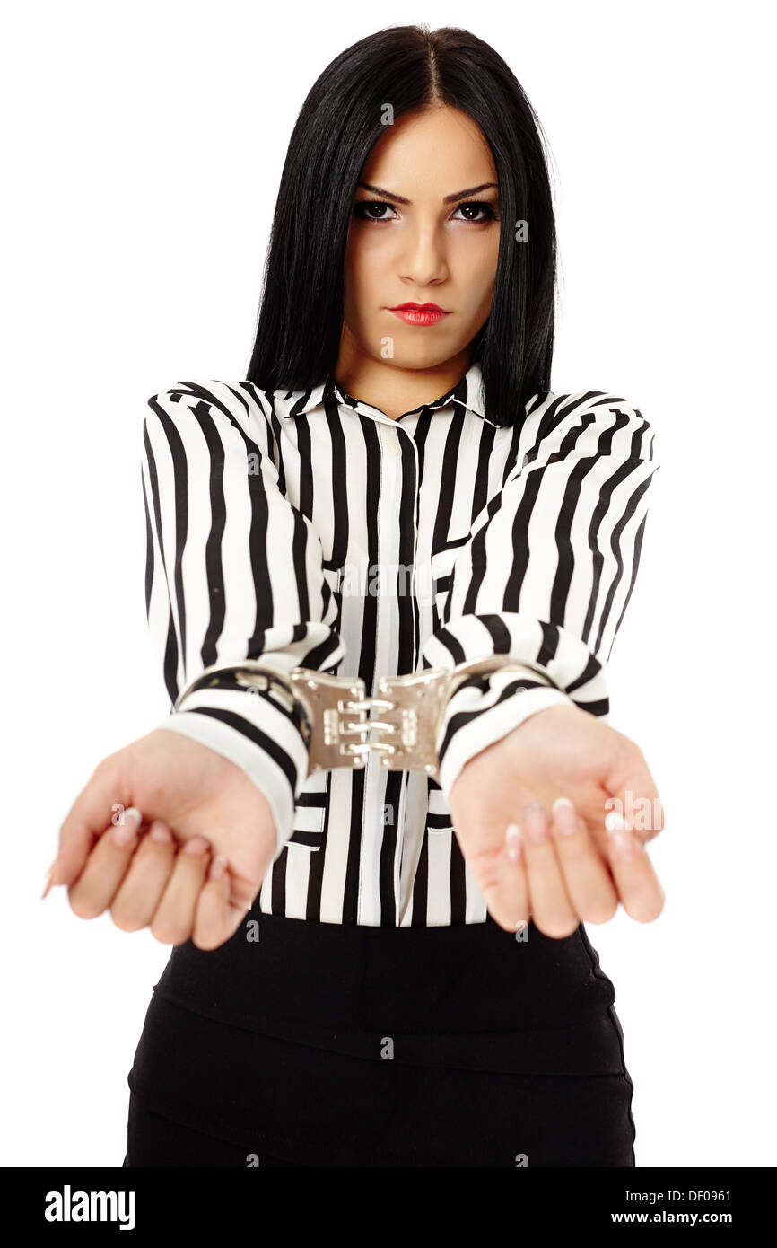 Young businesswoman with handcuffs isolated on white background Stock Photo