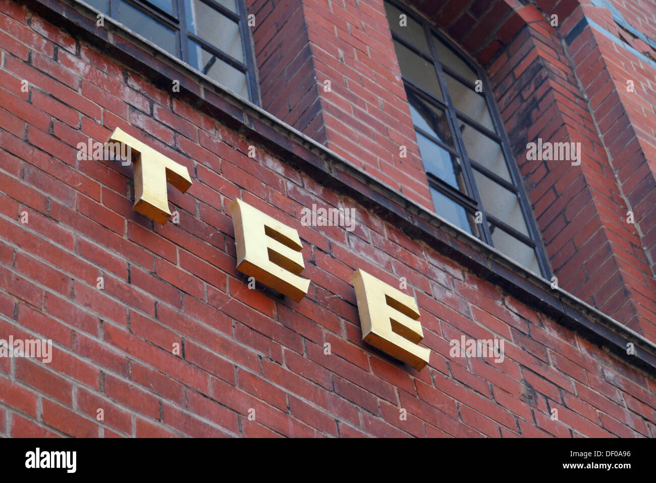 Lettering "TEE", German for "TEA" on the facade of a building in the Speicherstadt district in