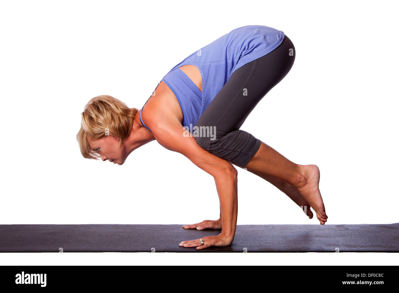 Beautiful sporty fit yogini woman practices yoga asana Bakasana - crane pose  arm balance isolated on..., Stock Photo, Picture And Low Budget Royalty  Free Image. Pic. ESY-055340075 | agefotostock