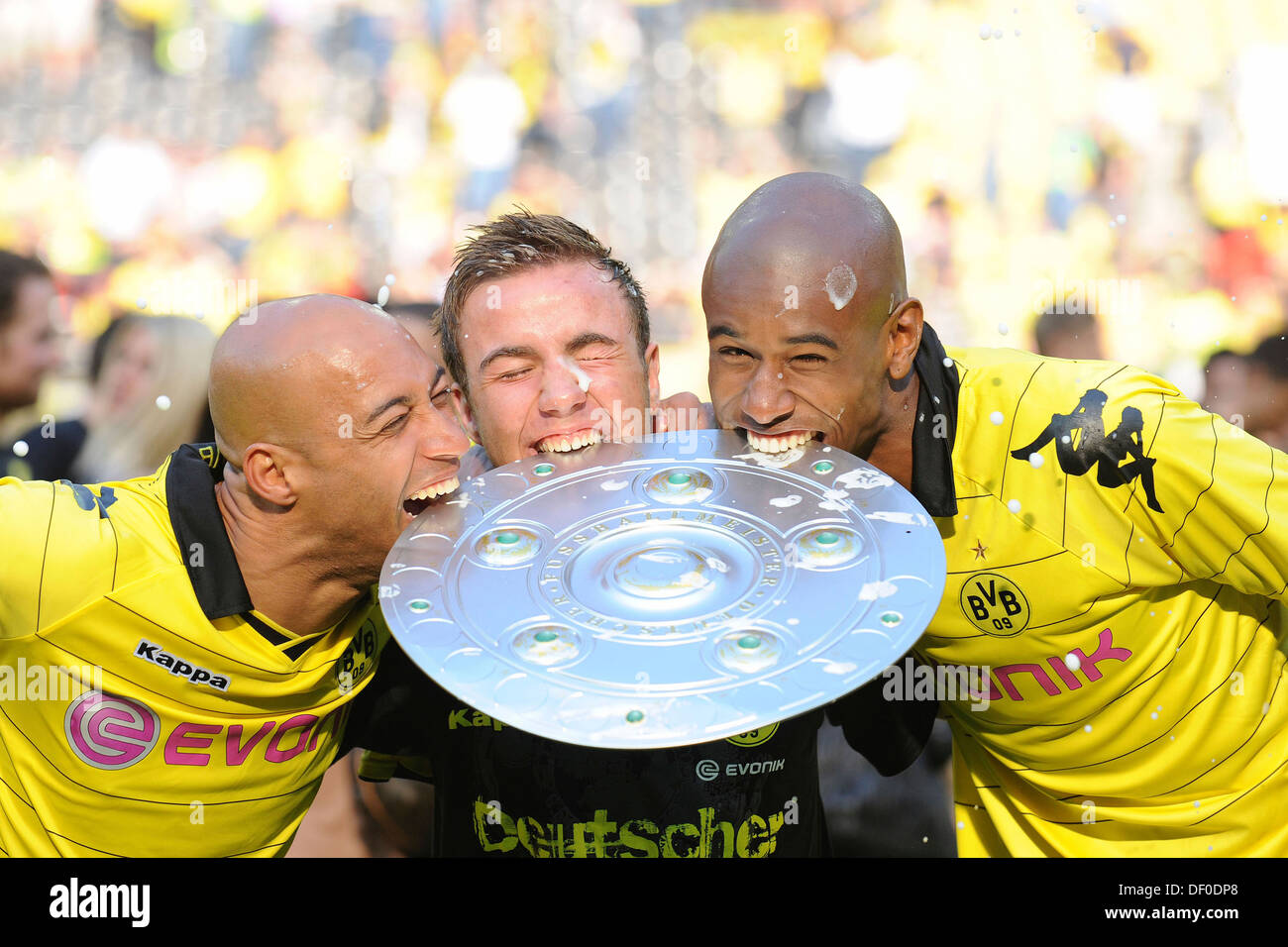 DEDE, Mario GOETZE, Felipe Santana, left to right, biting into the championship cup, Borussia Dortmund, German Champion 2011 Stock Photo