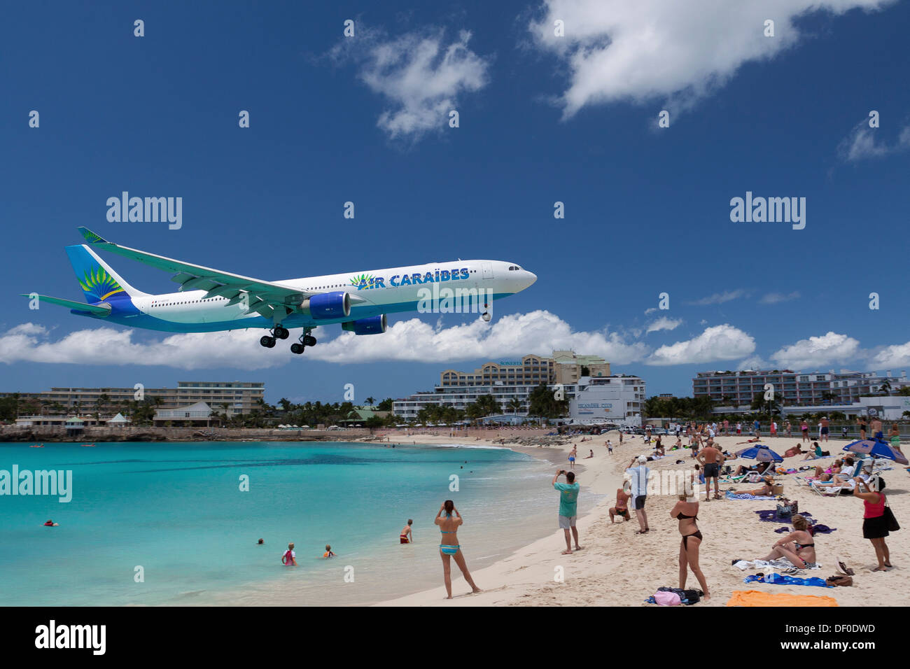 Air Caraibes aircraft landing over the beach of Saint Maarten, the