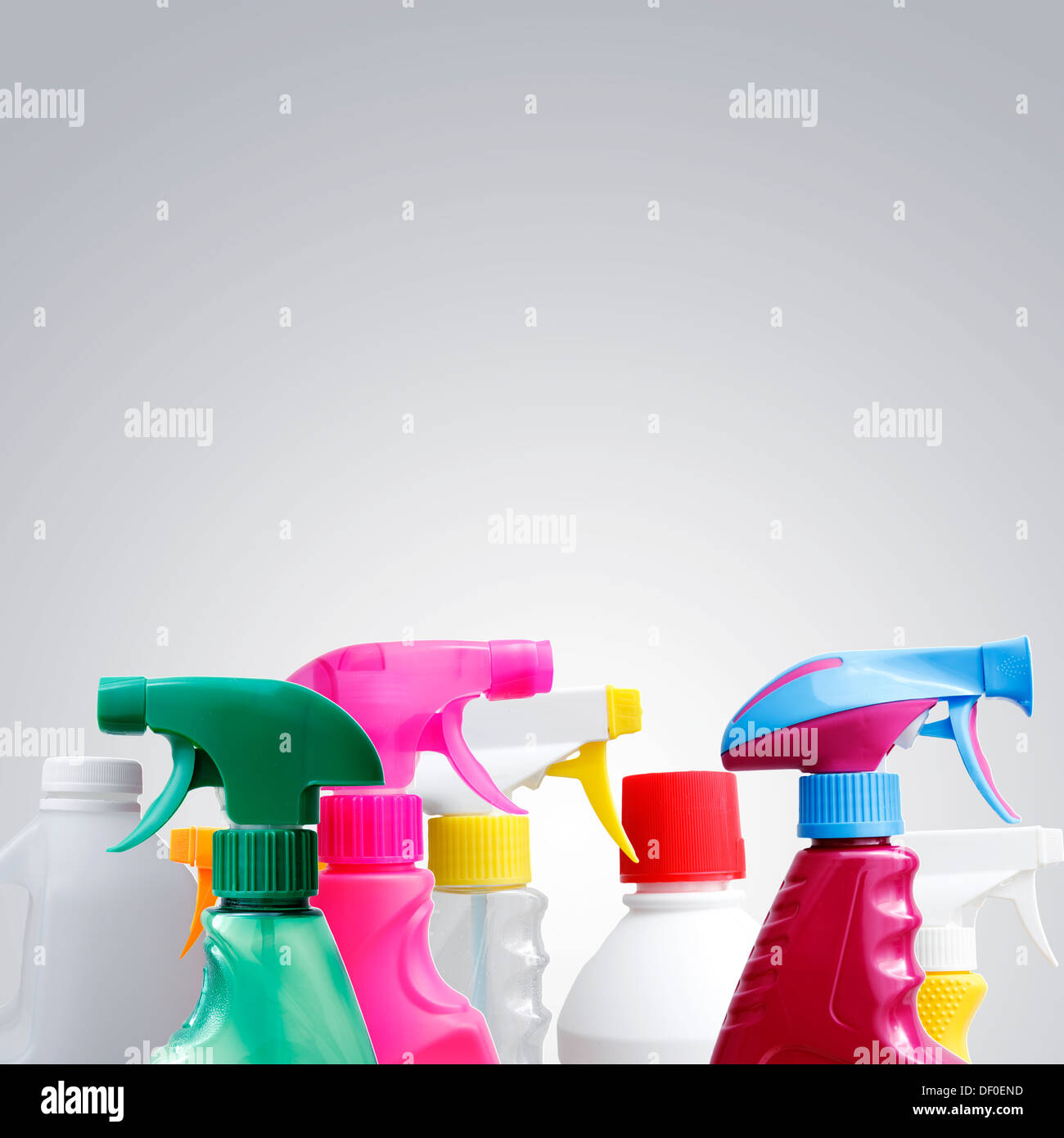 Cleaning bottles closeup. Grey background Stock Photo