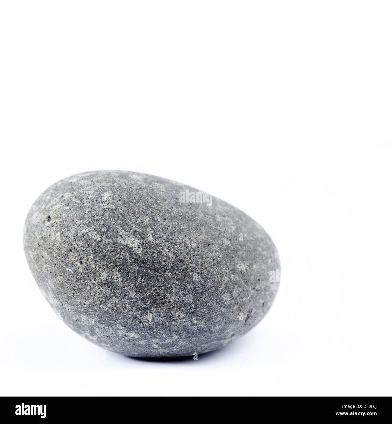 Closeup of one rock on plain background Stock Photo