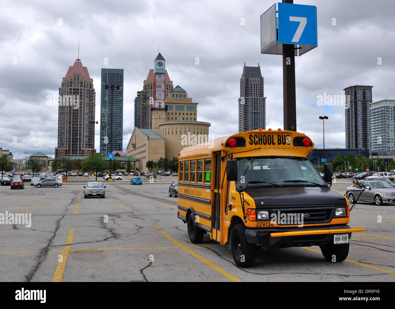 'First Student' School bus at car park identification post number 7 at a shopping mall in Mississauga, Ontario, Canada. Stock Photo