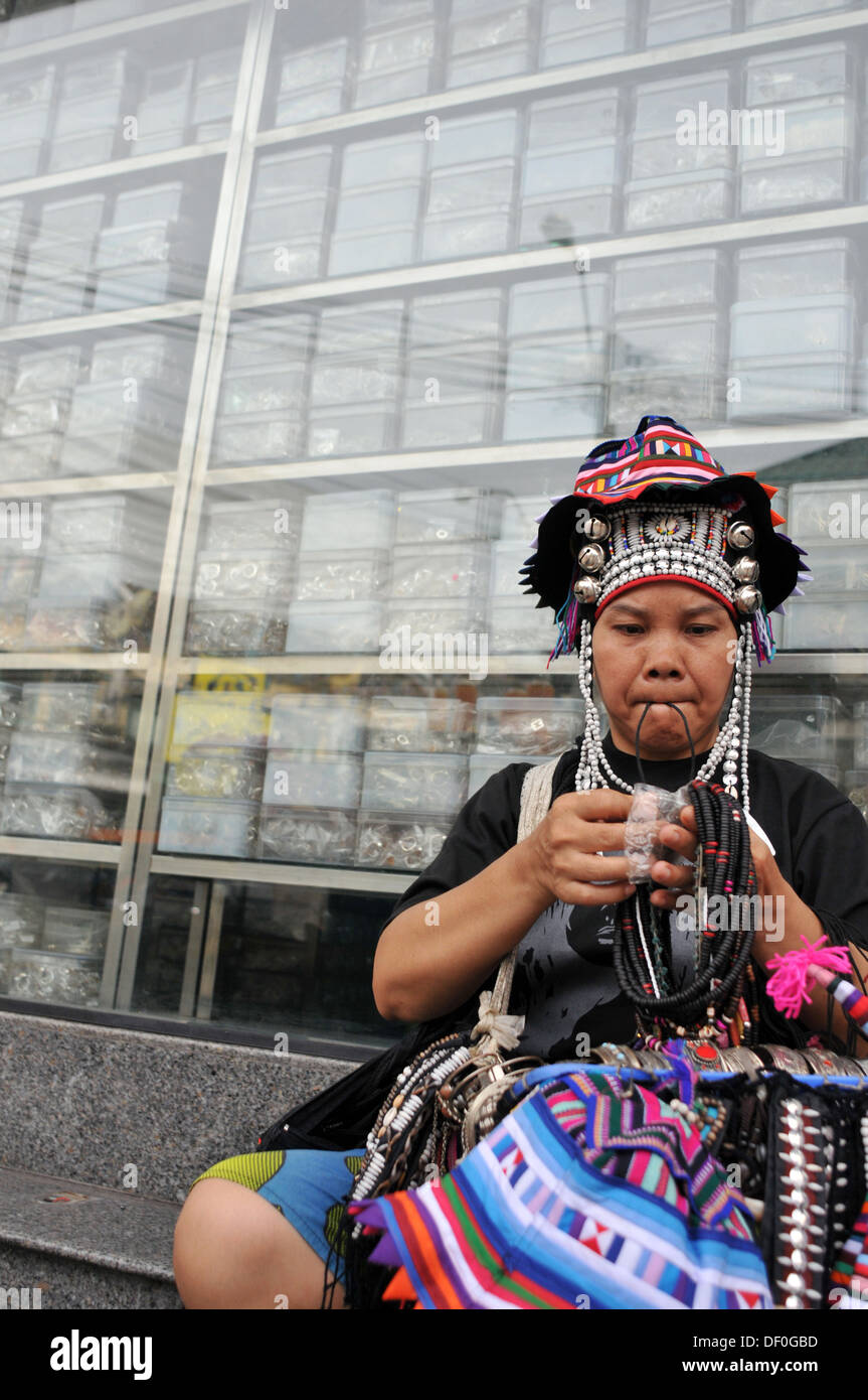 Thai woman sell craft on Khaosan Road in Bangkok, Thailand. Stock Photo