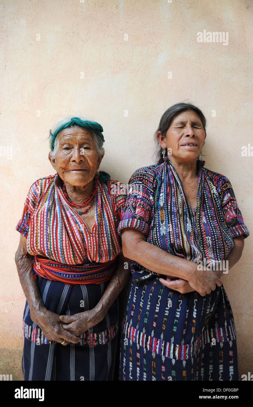 Guatemala indigenous mother and blind daughter from Solola in traditional clothing of called huipil(blouse) and corte (skirt). Stock Photo
