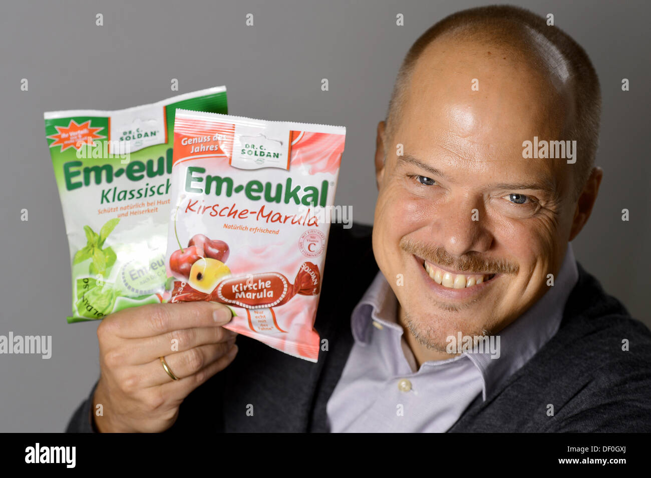 Perry Soldan (R), manager of the 'Dr.C.Soldan' confectionary company, shows different products of the 'Em-eukal' brand in Adlersdorf, Germany, 19 September 2013. The Company produces candy since 1899. Photo: David Ebener/dpa Stock Photo