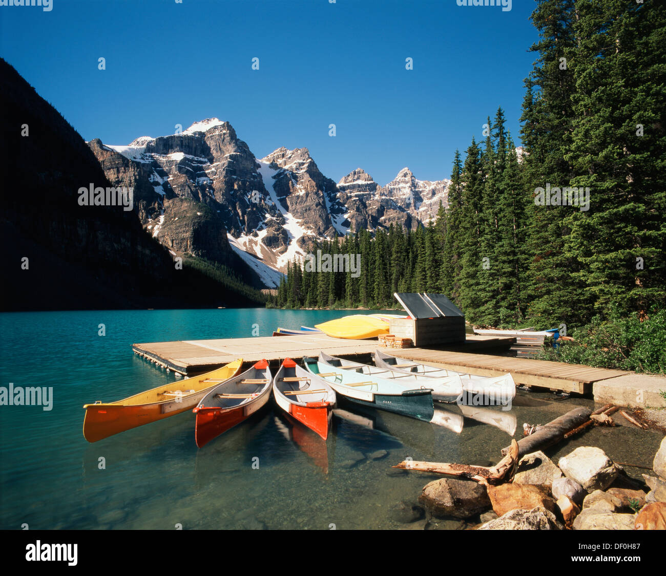 Banff Dock Canada, Alberta, Banff National Park, Canoe moored at dock on Moraine ...