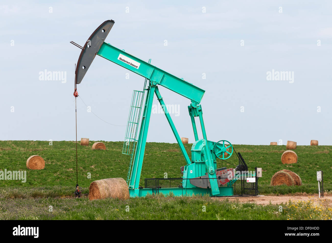 Crescent Point Energy pumpjack pumps crude oil from an oilfield well near Eastend Saskatchewan Canada Stock Photo