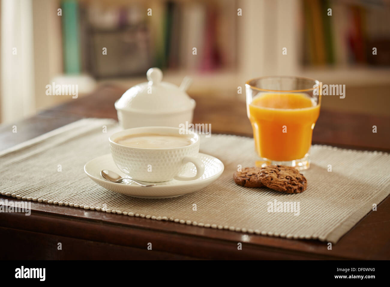 Lovely breakfast table with juice, coffe and cookies Stock Photo