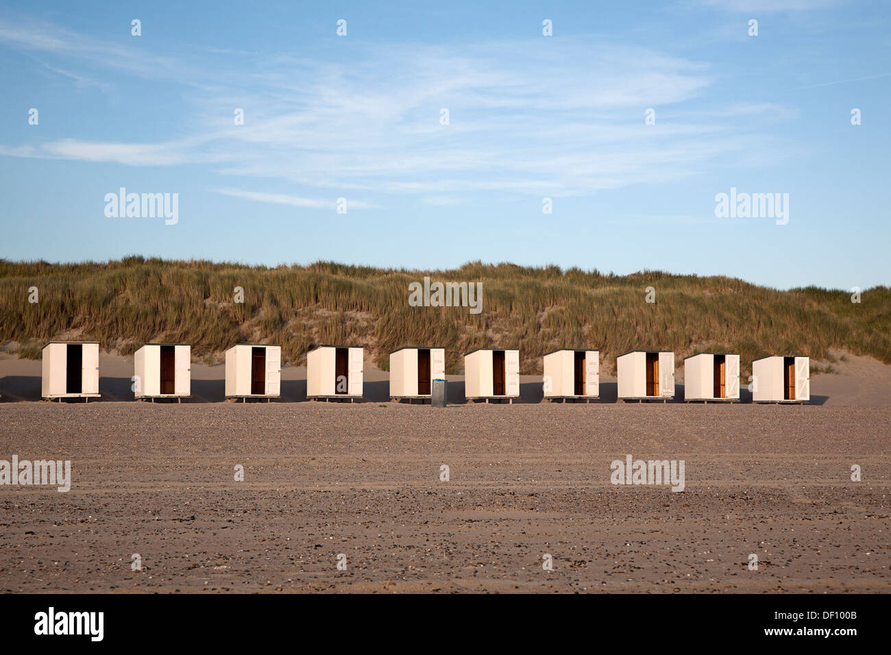 Row of ten empty, white beach cabins, Westenschouwen, Zeeland, Netherlands Stock Photo