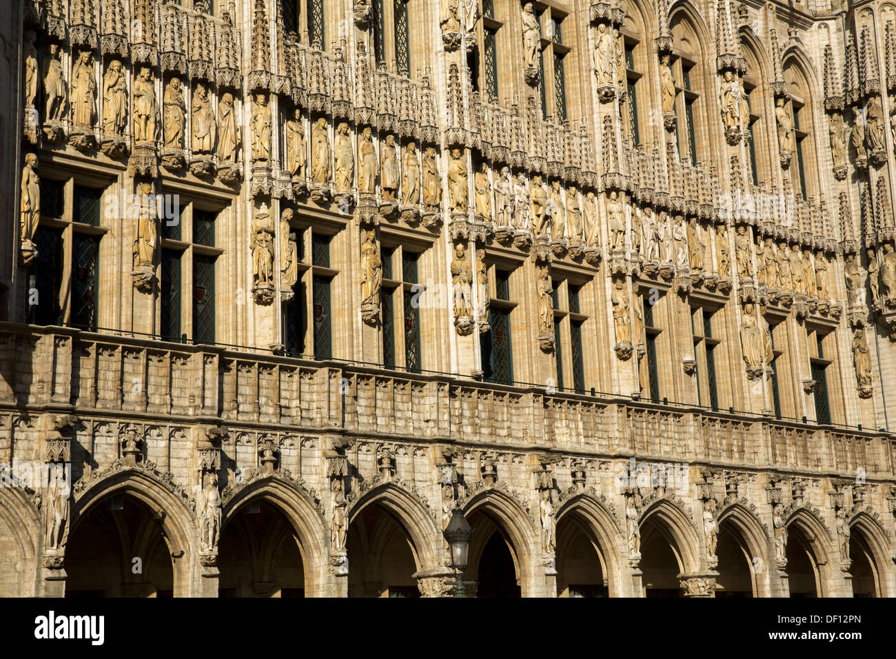 Ornate carved figures adorn the facade of the Hotel de Ville in Brussels. Stock Photo